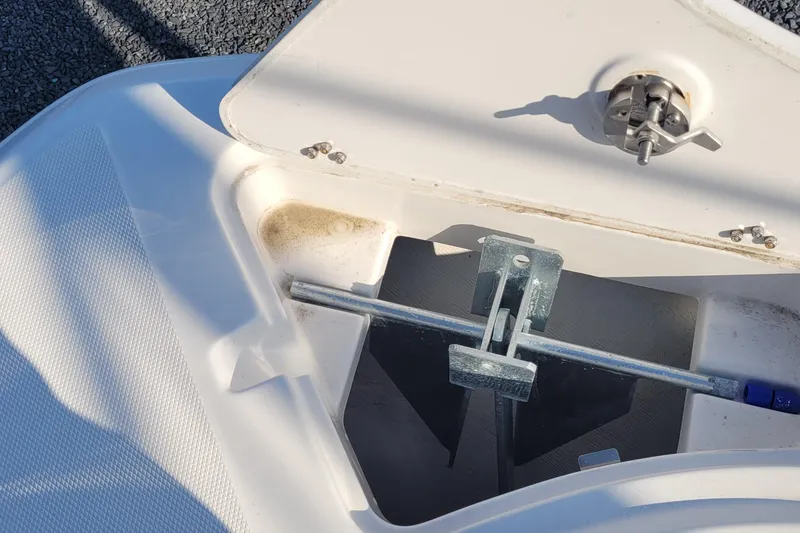 Slide: The Image of Anchor compartment of 2022 Aquasport 2100 Center Console boat, open and exposed. - 36