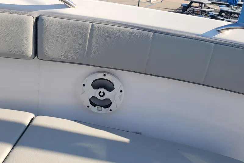 Slide: The Image of 2022 Aquasport 2100 Center Console boat interior with speaker and cushioned seating. - 42