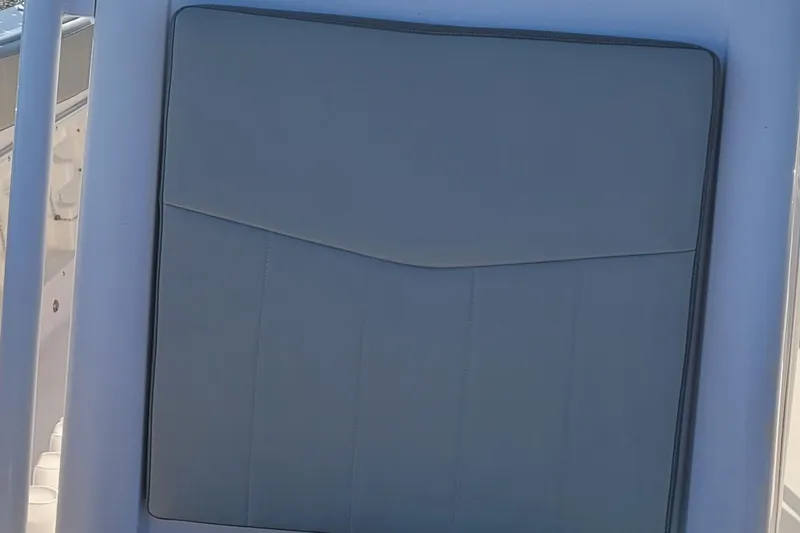 Slide: The Image of 2022 Aquasport 2100 Center Console boat seat detail, featuring sleek design and comfortable padding. - 45