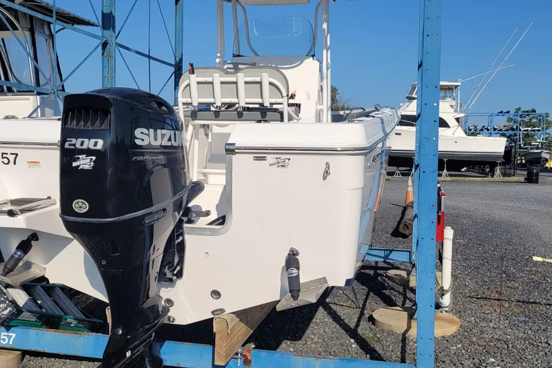 Slide: The Image of 2022 Aquasport 2100 Center Console boat with Suzuki 200 engine on display. - 54