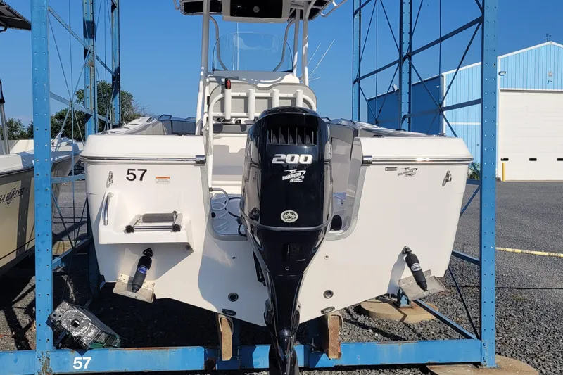 Slide: The Image of 2022 Aquasport 2100 Center Console boat with 200 HP engine on display. - 55