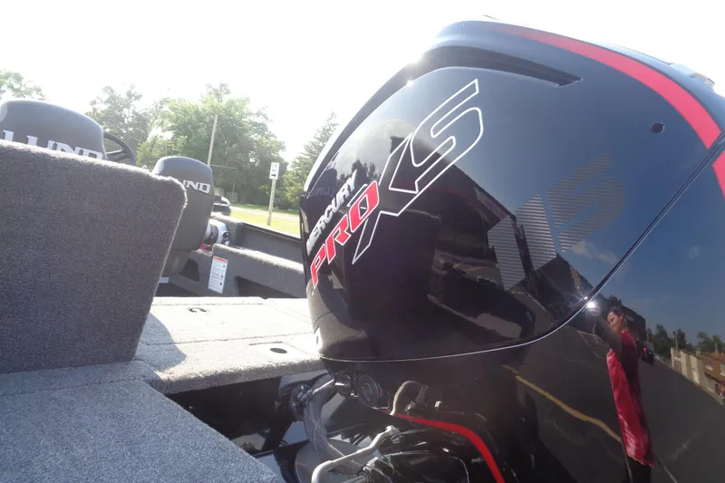 Slide: The Image of 2026 Lund 1775 Adventure SS boat with Mercury Pro XS engine, outdoor setting. - 4