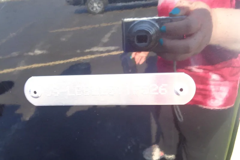 Slide: The Image of Reflection of a person taking a photo of a Lund 1775 Adventure SS, 2026 model. - 6