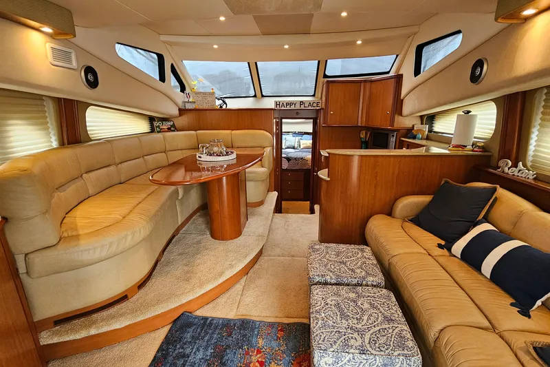 Slide: The Image of Luxurious interior of a 2007 Silverton 38 Sport Bridge yacht with plush seating and elegant decor. - 16