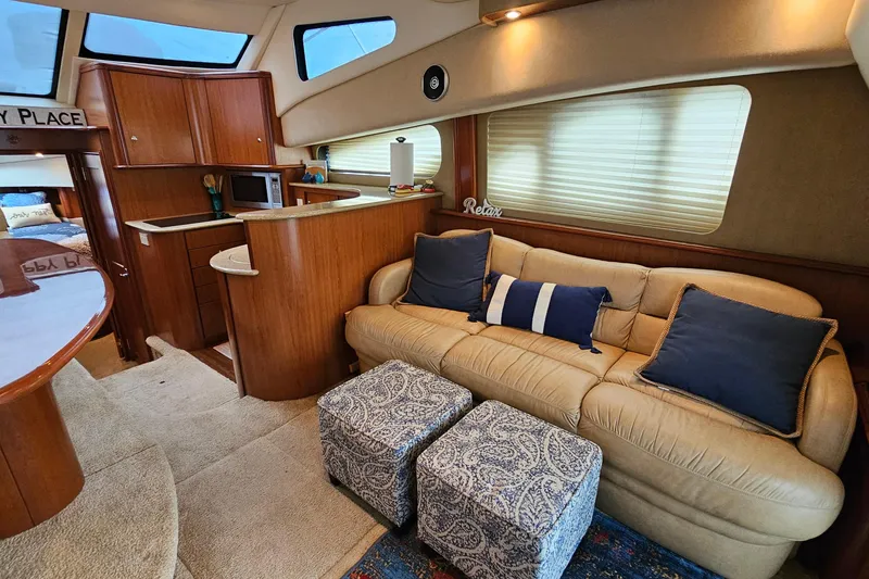 Slide: The Image of Interior of 2007 Silverton 38 Sport Bridge yacht with cozy seating and kitchenette. - 17