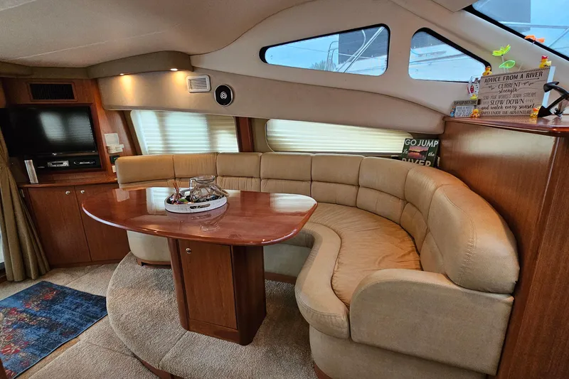 Slide: The Image of Luxurious interior of 2007 Silverton 38 Sport Bridge yacht with plush seating and elegant decor. - 20
