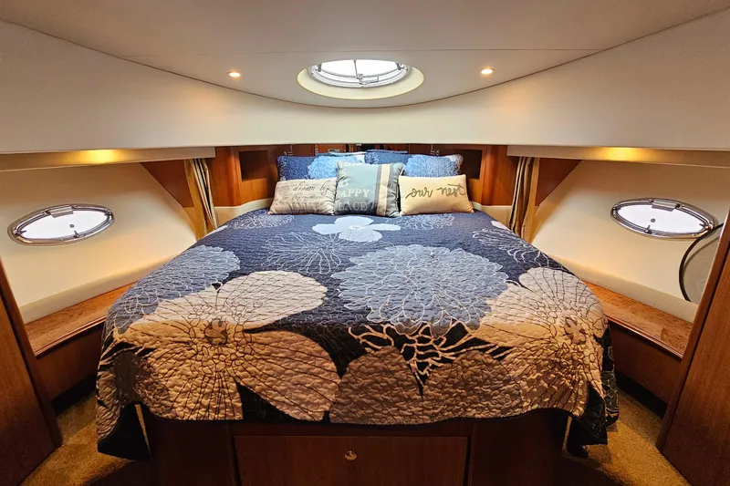 Slide: The Image of Luxurious cabin interior of 2007 Silverton 38 Sport Bridge yacht with floral bedding. - 25