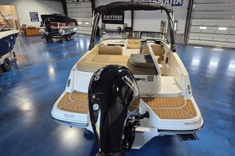 Slide: The Image of 2025 Bayliner VR5 OB boat with Mercury outboard engine in showroom. - 7