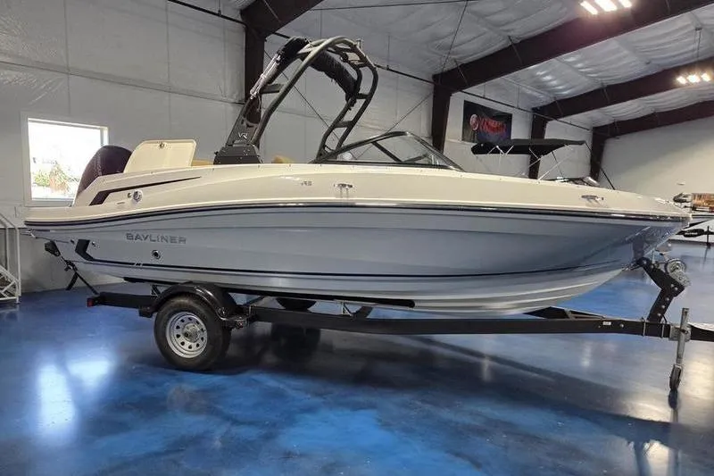 Slide: The Image of 2025 Bayliner VR5 OB boat on trailer in indoor showroom. - 8