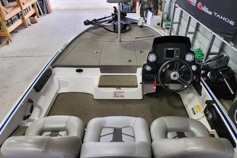 Slide: The Image of 2017 Nitro Z17 boat interior with steering wheel and seating in a garage. - 7