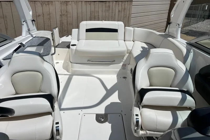 Slide: The Image of 2016 Chaparral 244 Sunesta boat interior with white seating and modern design. - 20