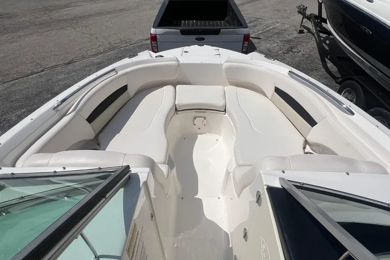 Slide: The Image of 2016 Chaparral 244 Sunesta boat interior with spacious seating and sleek design. - 4