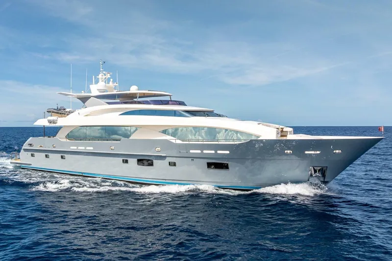 The Image of Luxurious 2017 Horizon RP120 yacht cruising on open sea under clear blue sky. - 1