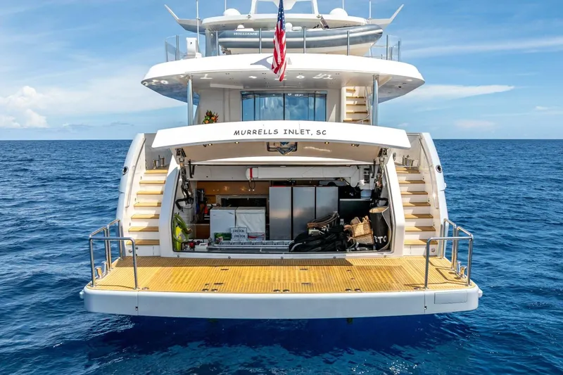 Slide: The Image of Luxury Horizon RP120 yacht, 2017 model, docked at sea with open storage area. - 10