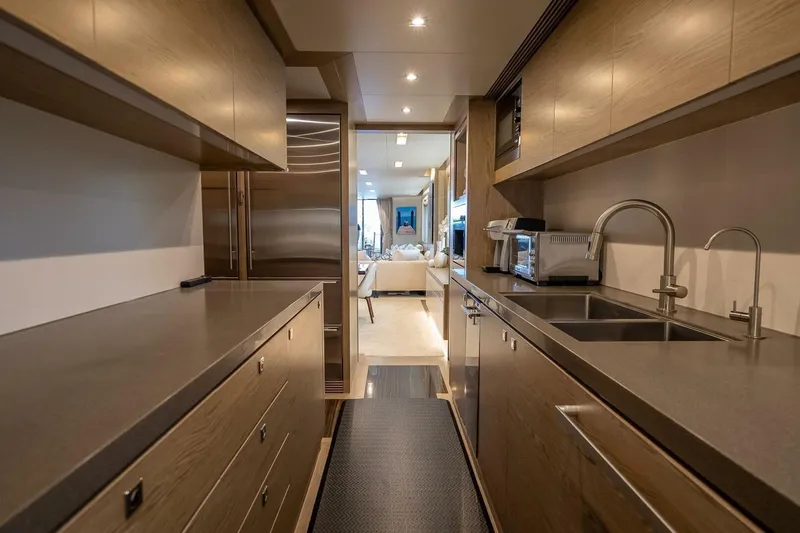 Slide: The Image of Luxurious galley kitchen on 2017 Horizon RP120 yacht with modern appliances and sleek design. - 21