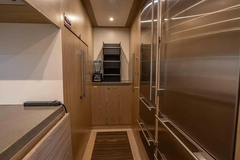 Slide: The Image of Modern kitchen interior with stainless steel appliances, wooden cabinetry, and a blender on the counter. Horizon RP120. - 23