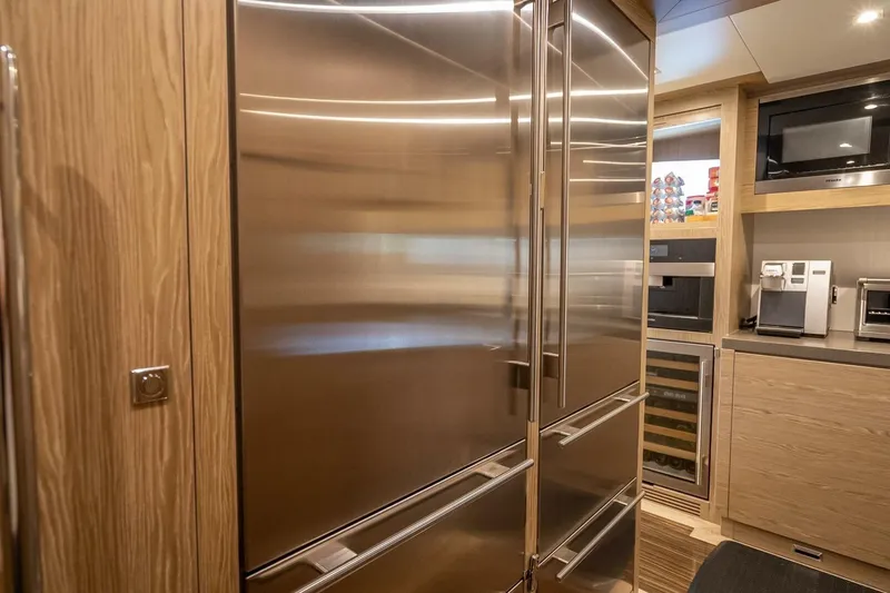 Slide: The Image of Modern kitchen with stainless steel appliances in a 2017 Horizon RP120 yacht. - 24