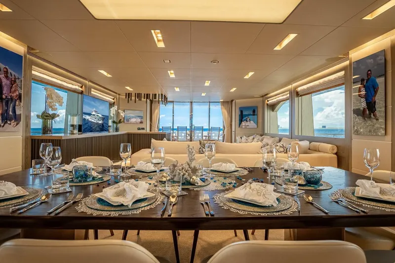 Slide: The Image of Luxurious dining area on 2017 Horizon RP120 yacht with elegant table setting and ocean views. - 26