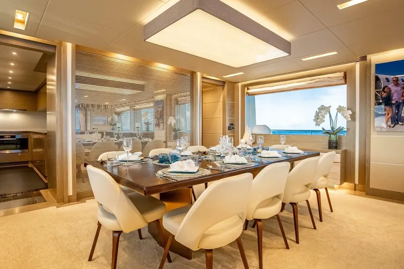 Slide: The Image of Luxurious dining area on 2017 Horizon RP120 yacht, featuring elegant table setting and ocean view. - 28