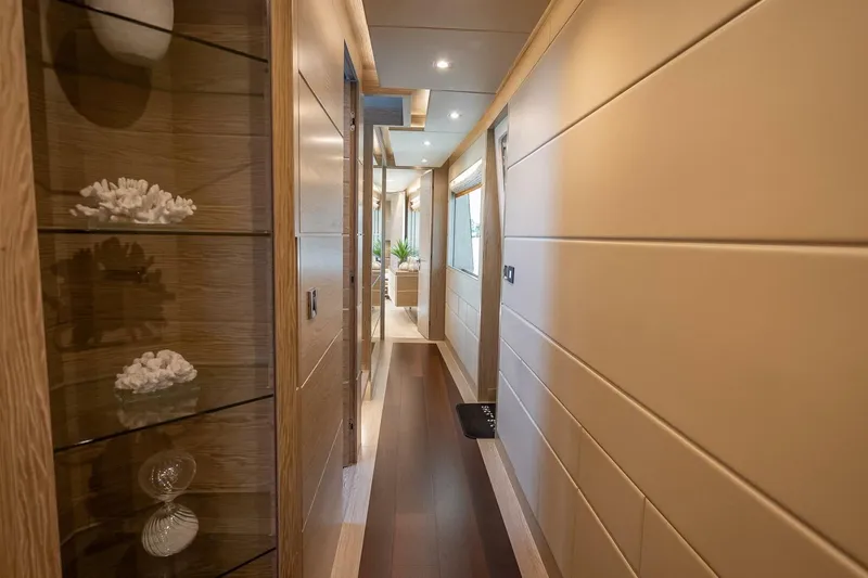 Slide: The Image of Luxurious hallway in 2017 Horizon RP120 yacht, featuring elegant decor and modern lighting. - 29