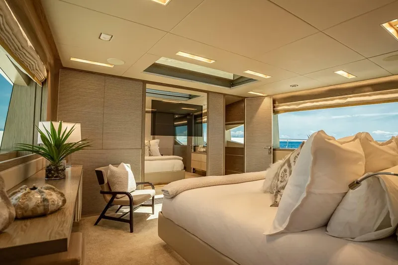 Slide: The Image of Luxurious bedroom interior on 2017 Horizon RP120 yacht, featuring elegant decor and ocean views. - 32
