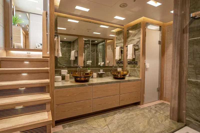 Slide: The Image of Luxurious yacht bathroom with dual sinks, wooden cabinetry, and elegant lighting, Horizon RP120, 2017. - 35