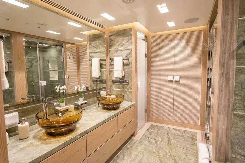Slide: The Image of Luxurious yacht bathroom with glass sinks, marble countertops, and modern lighting, Horizon RP120, 2017. - 36