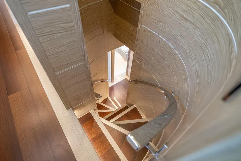 Slide: The Image of Spiral staircase with wooden finish inside Horizon RP120 yacht, 2017 model. - 39