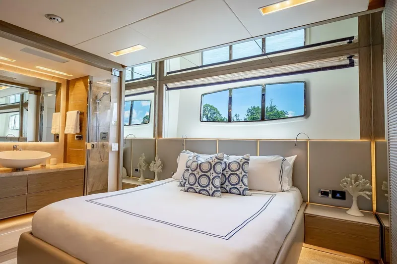 Slide: The Image of Luxurious yacht bedroom with modern decor, featuring a comfortable bed and elegant bathroom. Horizon RP120, 2017. - 40