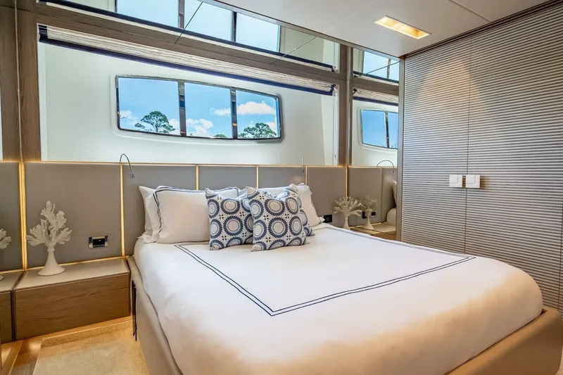 Slide: The Image of Luxurious bedroom interior on 2017 Horizon RP120 yacht with elegant decor and large windows. - 42