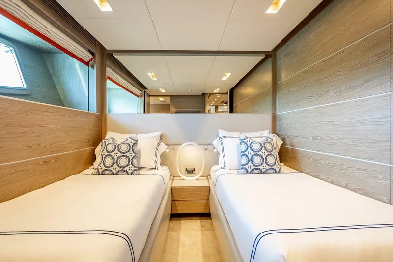 Slide: The Image of Luxurious twin bedroom on 2017 Horizon RP120 yacht with modern decor and elegant bedding. - 46