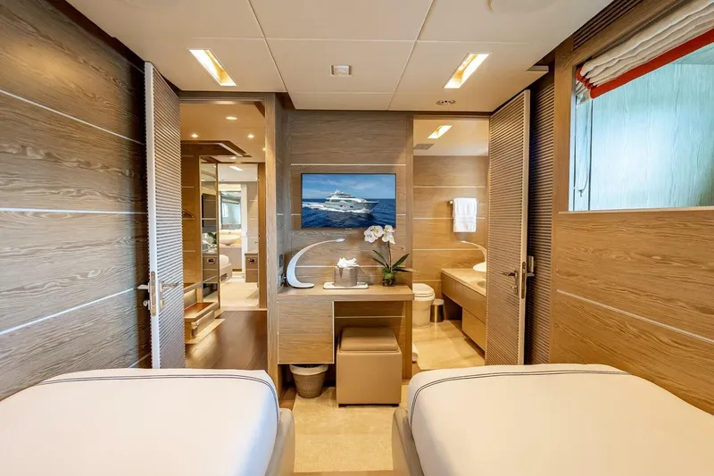Slide: The Image of Luxurious yacht interior with wooden decor, featuring twin beds and elegant furnishings, Horizon RP120, 2017. - 47