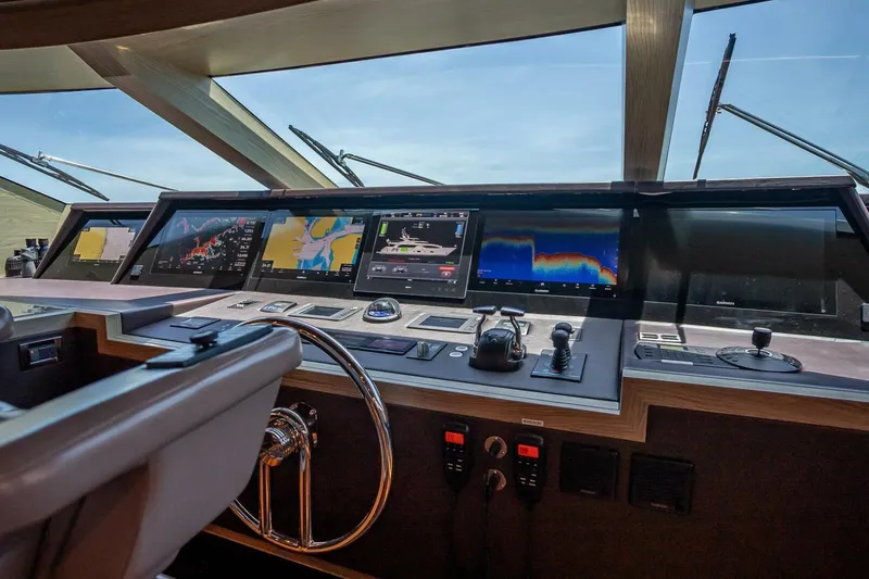 Slide: The Image of Control panel of a 2017 Horizon RP120 yacht with advanced navigation displays. - 55