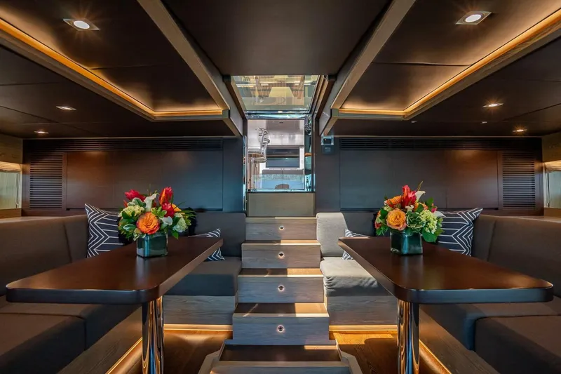 Slide: The Image of Luxurious interior of 2017 Horizon RP120 yacht with elegant seating and floral arrangements. - 58