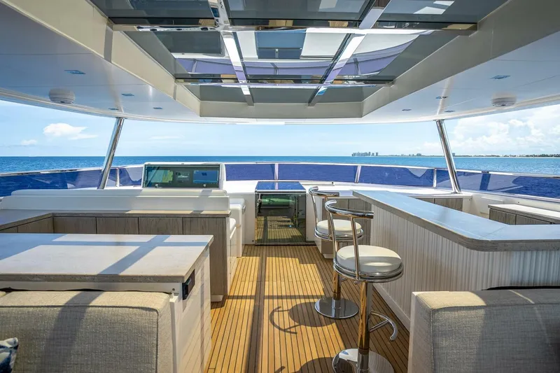 Slide: The Image of Luxurious 2017 Horizon RP120 yacht interior with ocean view and modern seating. - 64