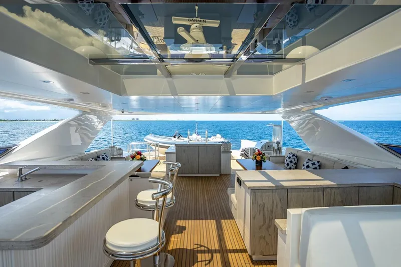 Slide: The Image of Luxurious Horizon RP120 yacht interior with bar, seating, and ocean view, 2017 model. - 66