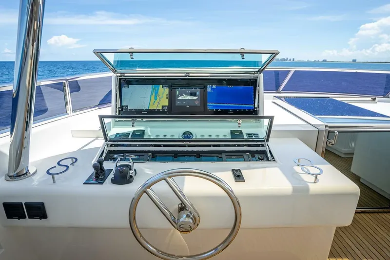 Slide: The Image of Helm of 2017 Horizon RP120 yacht with navigation screens and steering wheel. - 68