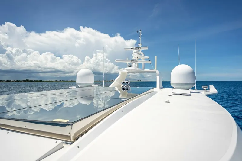Slide: The Image of Luxury Horizon RP120 yacht deck with navigation equipment, 2017 model, under clear blue sky. - 72