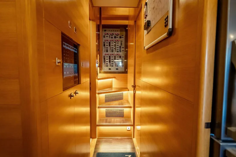 Slide: The Image of Luxurious wooden interior of 2017 Horizon RP120 yacht with illuminated stairs and control panel. - 77