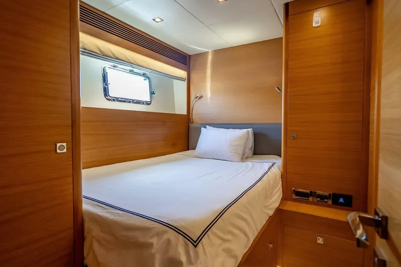 Slide: The Image of Luxurious cabin interior of 2017 Horizon RP120 yacht with wooden finish and cozy bed. - 78