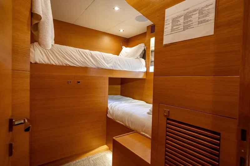 Slide: The Image of Compact wooden bunk bed cabin in 2017 Horizon RP120 yacht interior. - 79