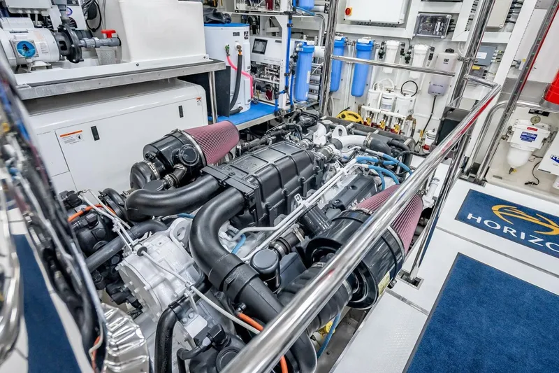 Slide: The Image of Engine room of 2017 Horizon RP120 yacht, showcasing advanced machinery and equipment. - 82
