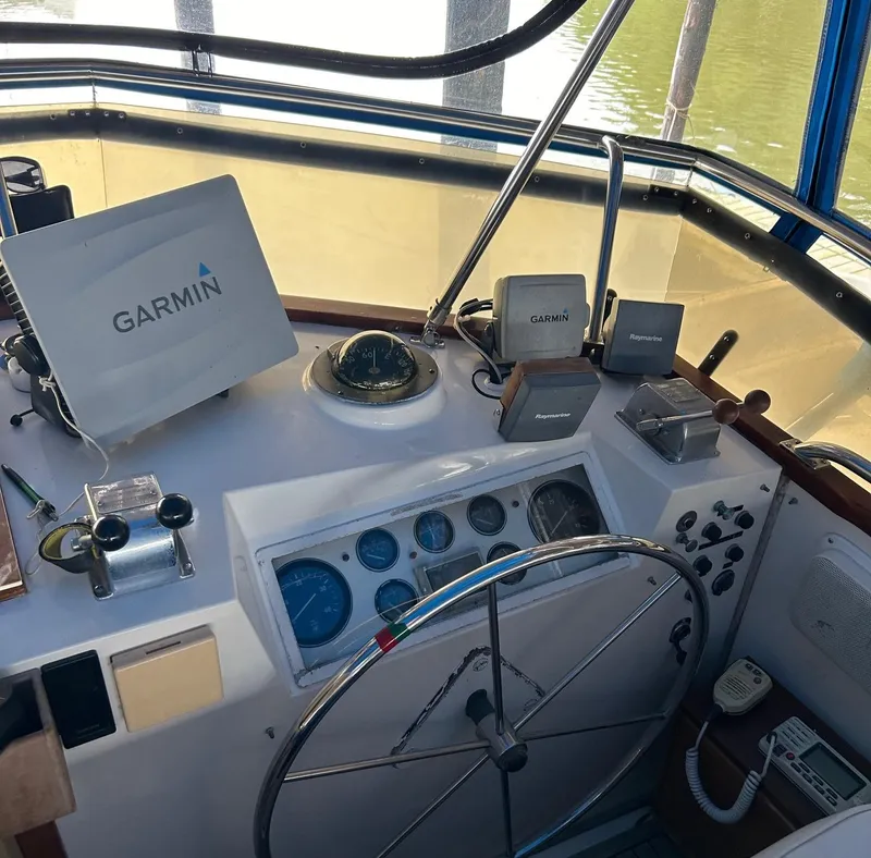 Slide: The Image of Helm of 1985 Grand Banks 42 Classic with Garmin navigation equipment. - 25