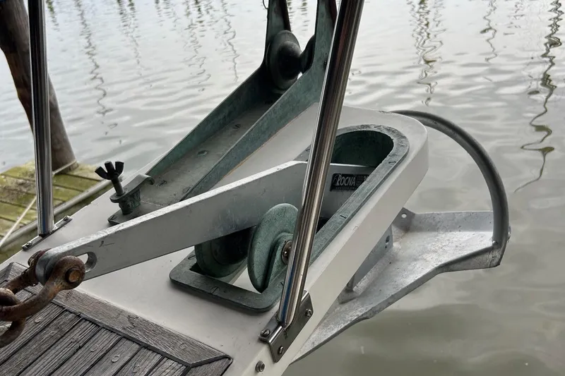 Slide: The Image of Anchor system on a 1985 Grand Banks 42 Classic yacht by the water. - 36