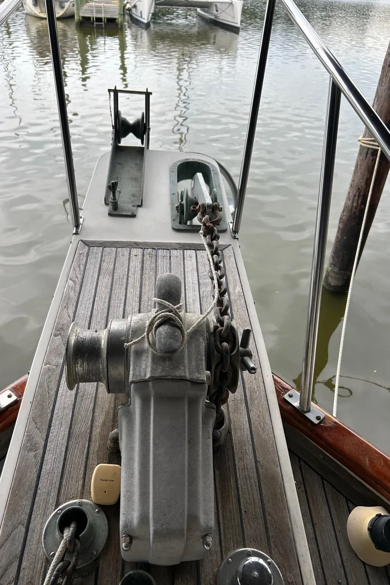 Slide: The Image of 1985 Grand Banks 42 Classic boat deck with anchor chain and winch. - 37