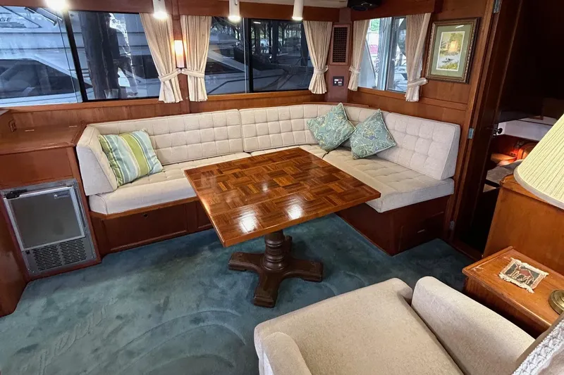 Slide: The Image of Interior of 1985 Grand Banks 42 Classic yacht with elegant seating and wooden table. - 4