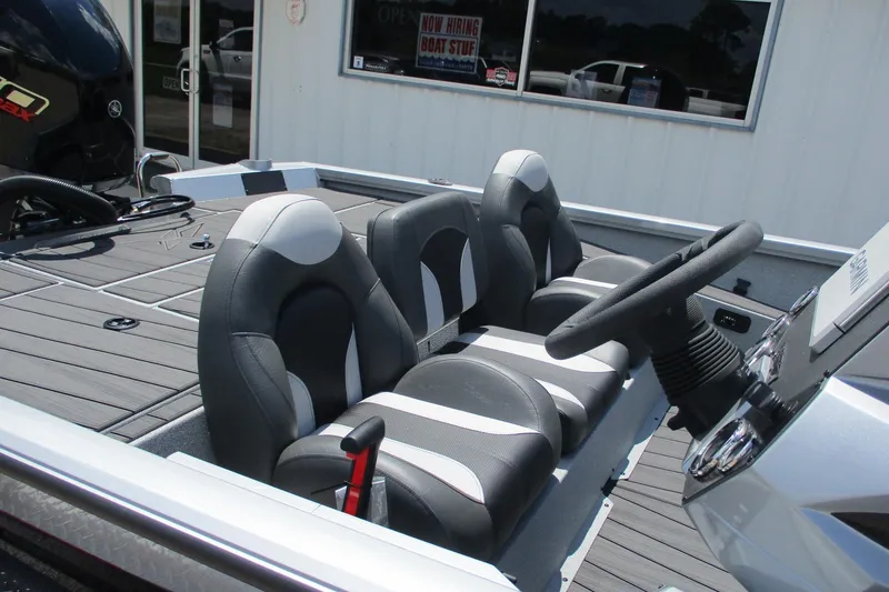 Slide: The Image of 2026 Vexus AVX1980 boat interior with dual seats and steering wheel. - 11