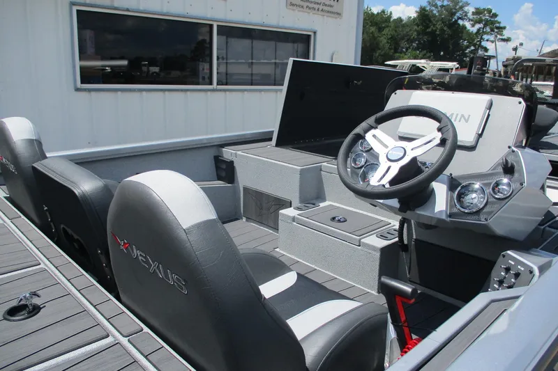 Slide: The Image of 2026 Vexus AVX1980 boat interior with steering wheel and seating. - 12
