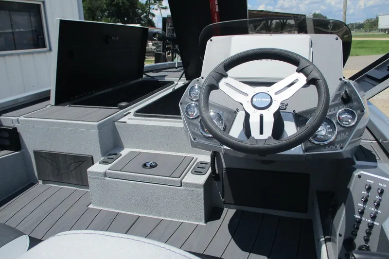 Slide: The Image of 2026 Vexus AVX1980 boat interior with steering wheel and dashboard controls. - 13