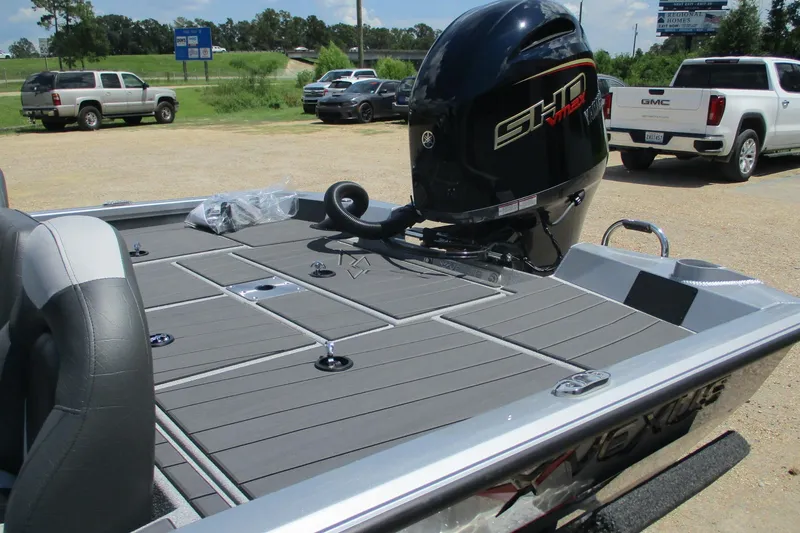 Slide: The Image of 2026 Vexus AVX1980 boat with powerful outboard motor in a parking lot. - 17